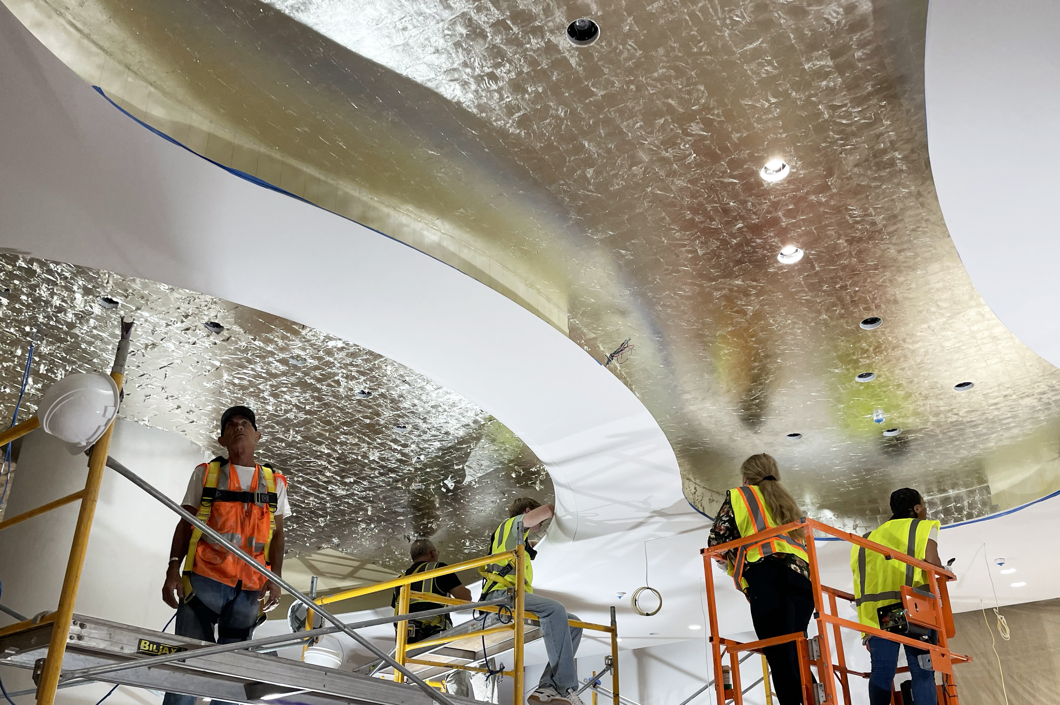 12kt gold leaf ceiling installation in high-end retail space